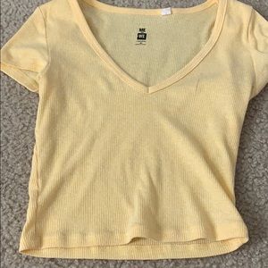 Yellow cropped shirt